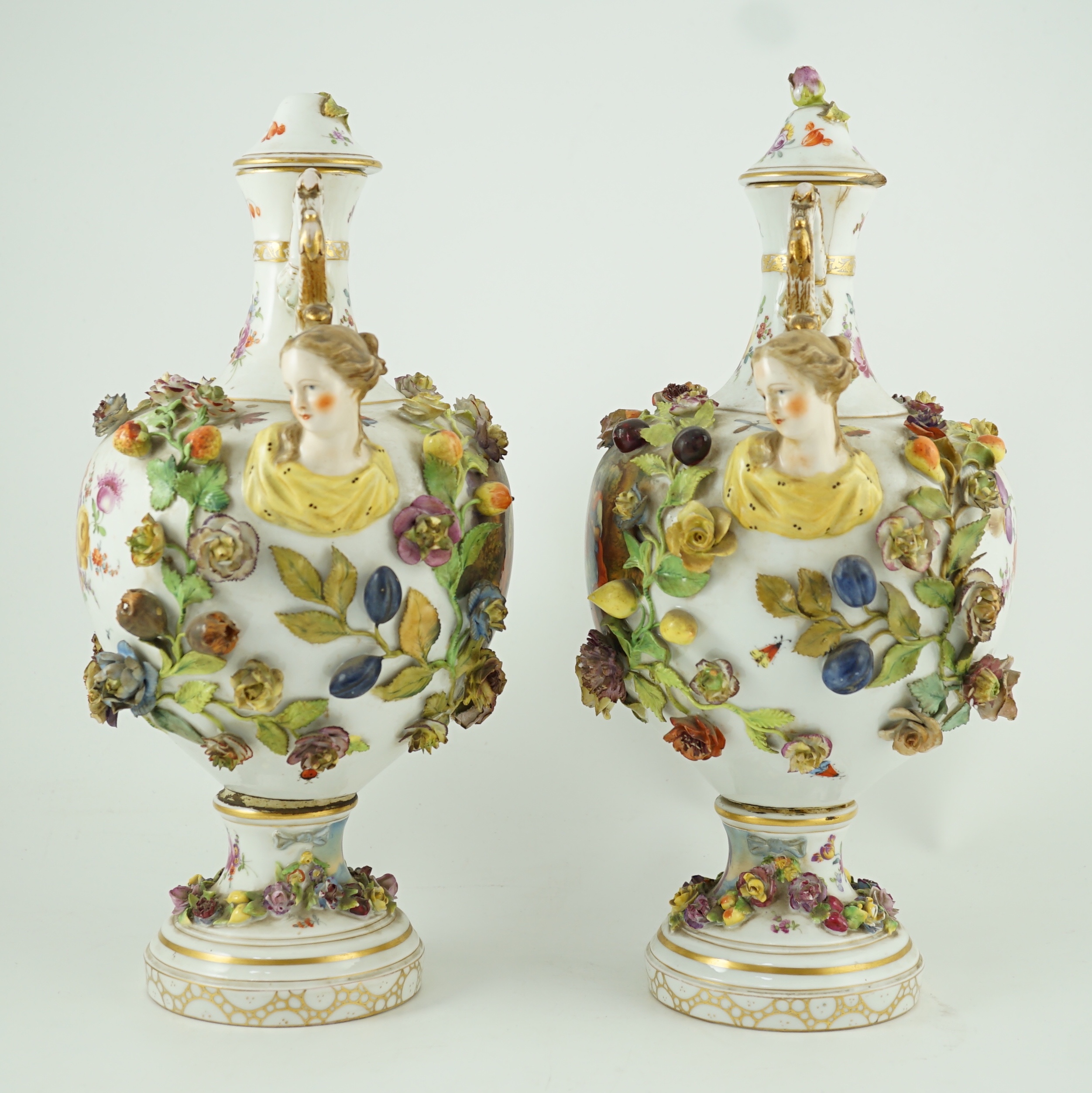 A pair of Potschappel porcelain vases and cover, late 19th century, 41cm high, slight damage